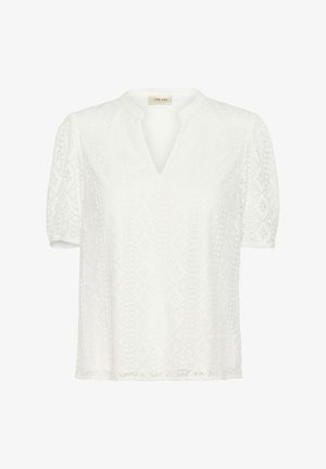 Balta trumpų rankovių bluzelė su V formos iškirpte, puošta sudėtingais deimanto formos nėriniais ir švelniu, tekstūruotu paviršiumi.