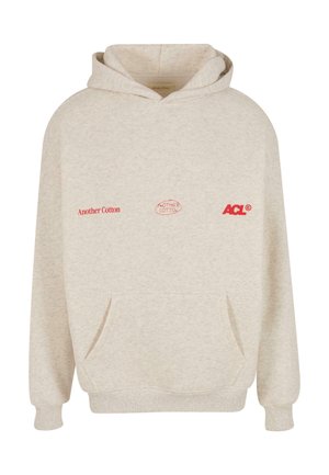 Beige hoodie van katoenmix. Voorzien van een buidelzak, ribgebreide manchetten, en bedrukte logo's in het rood op de borst. Zachte textuur.