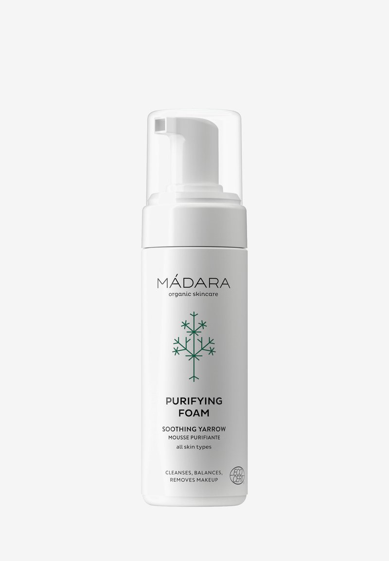 White cylindrical bottle with pump dispenser, features green tree graphic and text. Label includes product name and functions for all skin types.