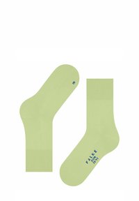 Chaussettes vert clair avec des poignets côtelés, design de pointe sans couture et marquage bleu. Disponibles en formes pour pied gauche et pied droit.