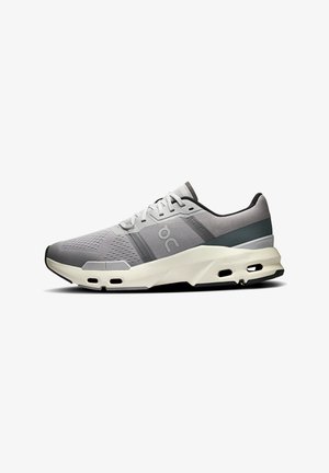 Gray athletic shoe featuring a textured upper, mesh panels, and contrasting black accents. CloudTec sole with visible cushioning channels.