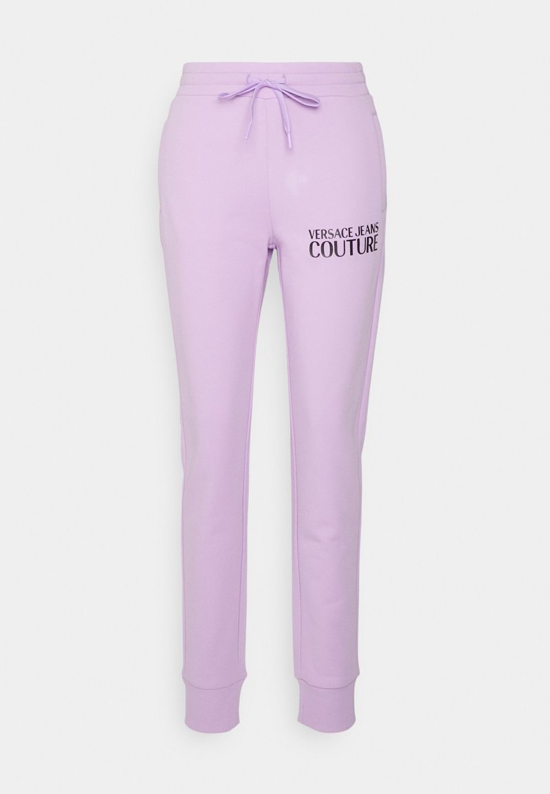 Fialové bavlněné tepláky s elastickým pasem, nastavitelnou šňůrkou a potiskem loga "VERSACE JEANS COUTURE" na levé straně.