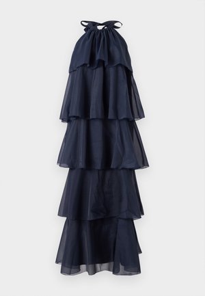 Navy blauwe gelaagde jurk met een halterhalslijn. Gemaakt van doorzichtige stof, met vloeiende lagen en een geraffineerd lijfje. Gelaagde en lichte stof.