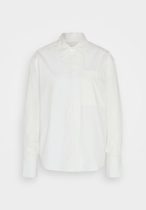 White long-sleeve shirt made of lightweight cotton. Features a classic collar, button closure, and a single chest pocket. Smooth texture.