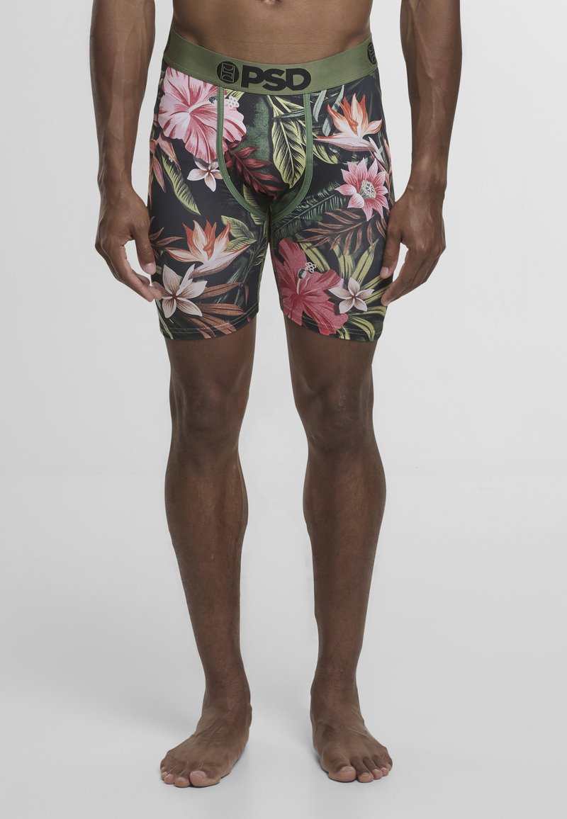 Męskie bokserki na czarnym tle, zdobione kolorowymi tropikalnymi wzorami kwiatowymi w różu i zieleni. Elastyczna talia z napisem "PSD".