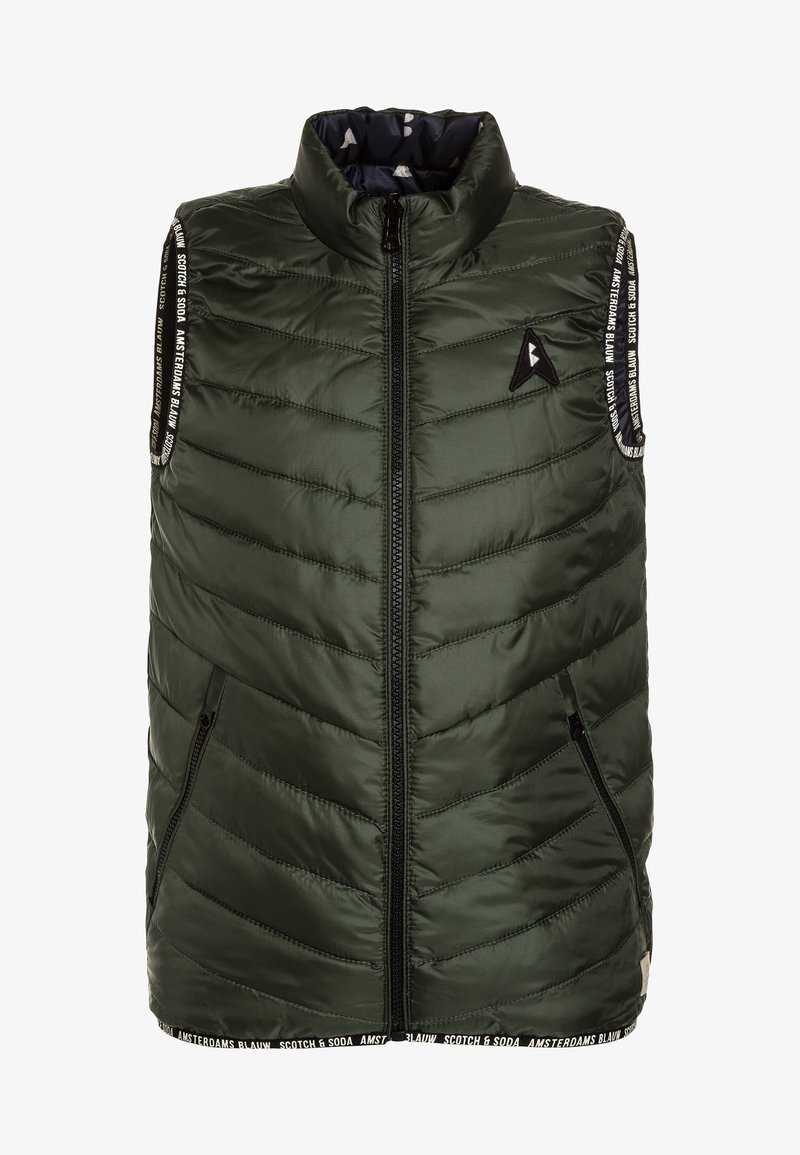 Green puffy vest with a high collar, zip closure, angled pockets, and branding detail on the shoulder straps. Textured, quilted pattern.