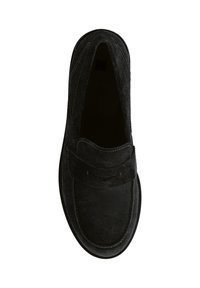 Black suede loafer with a rounded toe, featuring a stitched trim and a strap detail across the upper. Flat sole design, smooth texture.