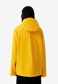 Hunter ORIGINAL IZZY UNISEX - Regnjakke - gold fusion