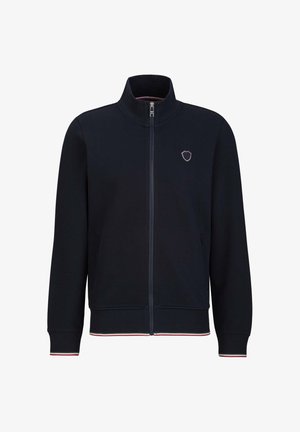 Marineblauer Zip-Jacke mit hohem Kragen, roten und weißen gestreiften Akzenten an den Bündchen und dem Saum, mit einem kleinen Wappen-Logo auf der Brust.