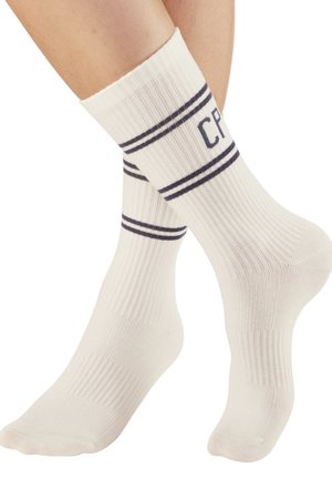 Cremfarbene gerippte Socken mit navyblauen Streifen und "CP"-Schriftzug am Bündchen. Entworfen für Komfort und einen lässigen Look.
