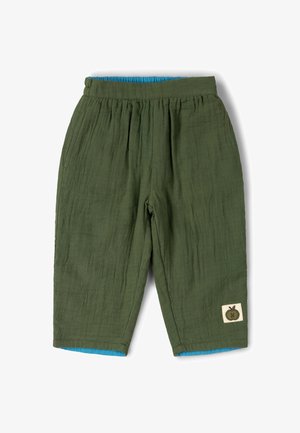 Children’s olive green linen pants with elastic waistband, blue inner lining, and small apple patch on lower right leg.