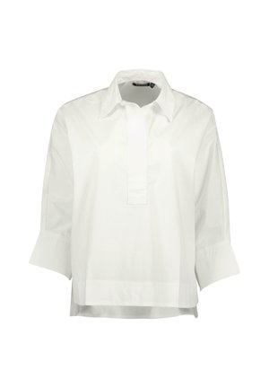 Blusa bianca in tessuto di cotone, con colletto a punta, maniche a tre quarti e una placca con mezzi bottoni davanti.