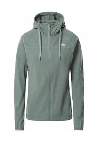 Chaqueta de forro polar verde claro con cremallera y capucha, cordones, mangas largas y el logo de The North Face en la parte superior del lado izquierdo del pecho.