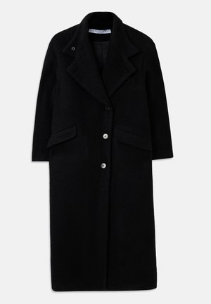 Long manteau noir en laine avec grands revers, trois boutons devant, deux poches à Rabat et manches longues.