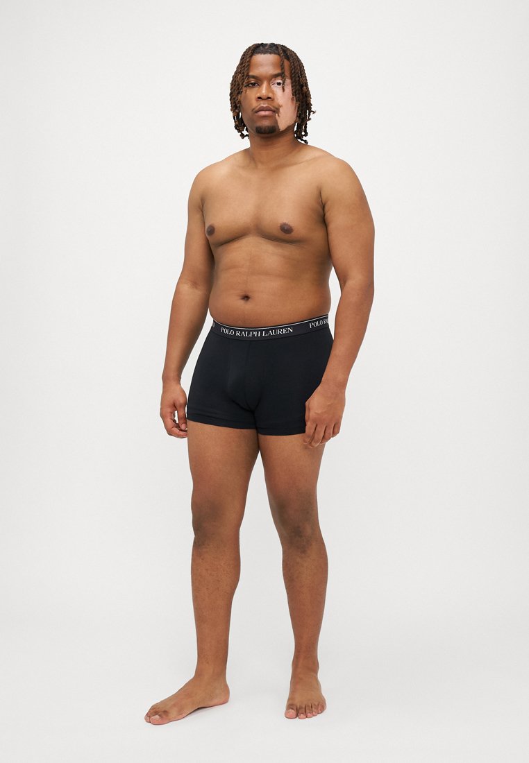 Boxer-briefs noirs au design ajusté et à la taille élastique arborant le logo "POLO RALPH LAUREN", présentés sur un fond neutre.