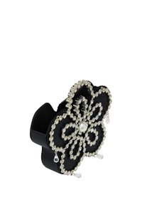 Sort læder håndtaske designet i en blomsterform, prydet med en perle i midten og klare rhinestones, med hængende krystalakcenter.