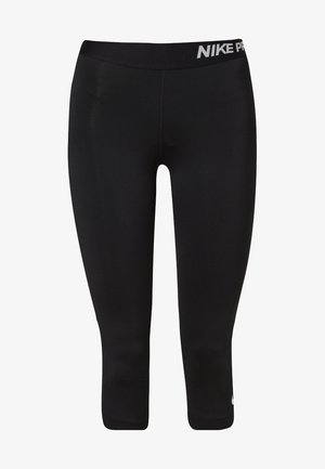 Leggings cropped negros Nike Pro con cinturilla elástica ancha y texto de logo blanco en el lado derecho de la cinturilla y cerca del tobillo izquierdo.