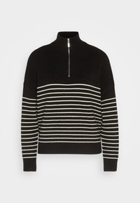 Pull en maille noir avec des rayures blanches horizontales sur le corps et les manches, doté d'un col montant et d'une fermeture éclair devant jusqu'à mi-hauteur.