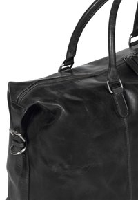Sort l�æder rejsetaske med glat tekstur, topzip lukning, dobbelte hanke og metal hardware detaljer. Kompakt design.