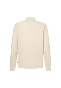 Ilgām piedurknēm polo krekls krēmkrāsā, izgatavots no mīkstas kokvilnas maisījuma. Iespējo klasisku apkakli un taisnu griezumu ar ribotām aprocēm.