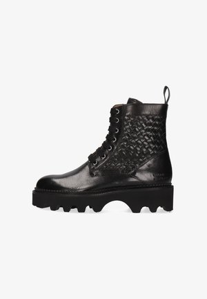 Black leather ankle boot featuring a woven design on the side, round toe, lace-up front, and a thick, chunky sole with cutout sections.