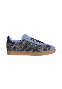 Floral-patterned sneakers with a blue upper, navy accents, and gum sole. Features three dark stripes and a textured upper for grip.