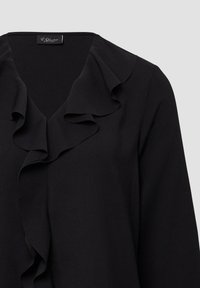 Zwarte blouse met een V-hals en ruches. Gemaakt van soepele stof, met lange mouwen en een schoon, minimalistisch ontwerp.