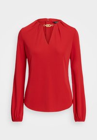 Blusa rossa a maniche lunghe in materiale leggero, con scollatura a V, dettagli arricciati sulle spalle e zip sul retro con hardware dorato.