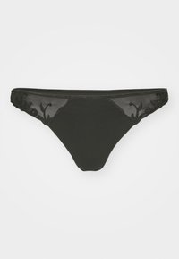 String noir en tissu transparent avec des panneaux en maille et des accents floraux brodés sur les côtés, offrant un mélange de matériaux et de textures.