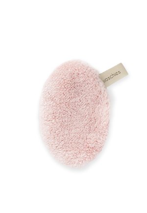 Soft, oval-shaped pink exfoliating facial pad with a fabric tag labeled "waschies" on a white background.