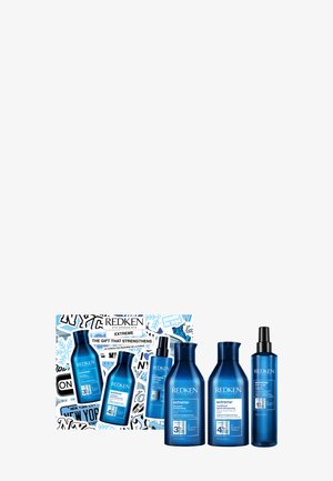 Il set di cura dei capelli Redken Extreme include due bottiglie di plastica blu (shampoo, balsamo), uno spray e un'imballaggio decorativo con grafiche.