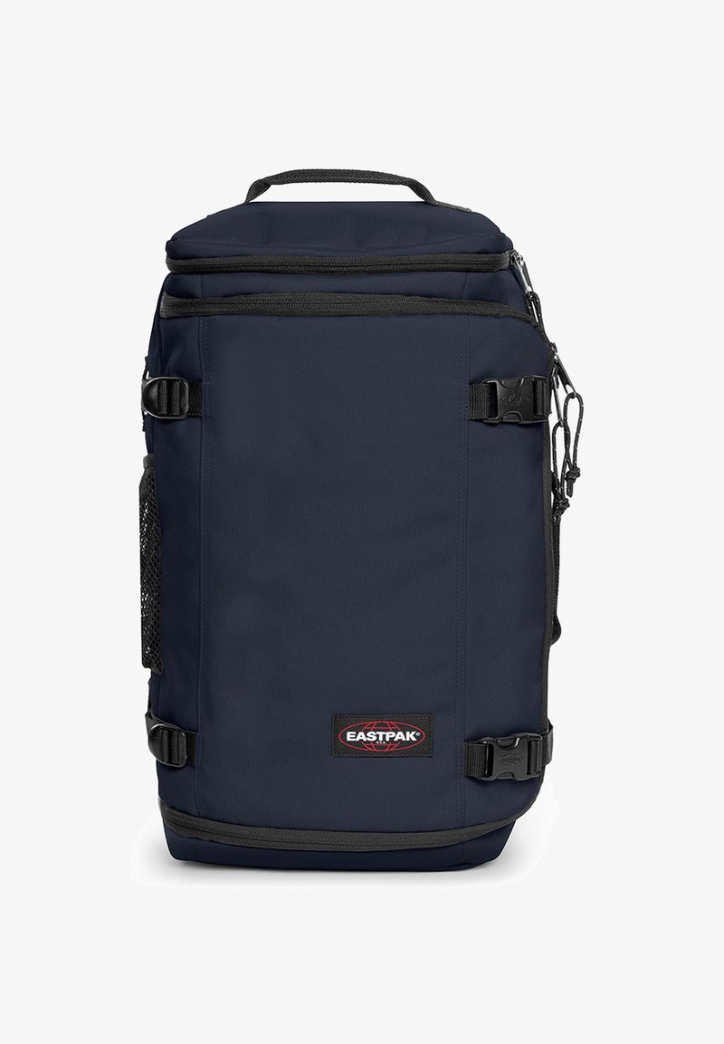 Námorně modrý batoh Eastpak s vrchním madlem, nastavitelnými popruhy, zipovým uzávěrem a síťovou boční kapsou s logem v přední části.