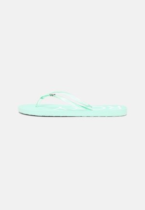 Mint green flip-flop with transparent straps, featuring a flat sole and embossed logo on the footbed. Minimalist design with no patterns.