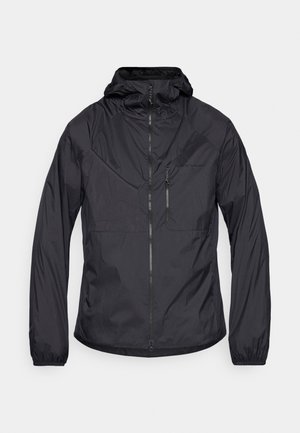 Black, lightweight jacket with a full zip, adjustable hood, and elastic cuffs. Features a chest pocket and sleek, minimalist design.