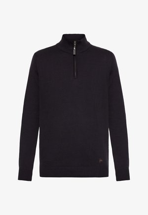 Pull noir en tricot, avec un col haut et une courte fermeture éclair, des poignets côtelés et une finition texturée. Petit logo en bas.
