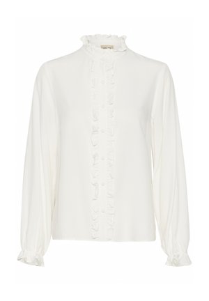 Blouse blanche avec un devant froncé, col montant et manches longues. Fabriquée dans un tissu lisse avec des boutonnières au centre.