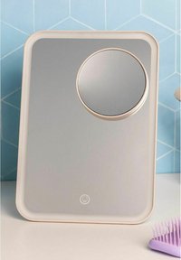 Rectangular mirror with a grey surface, thin rose gold frame, and a circular inset mirror. Smooth texture with modern geometric design.