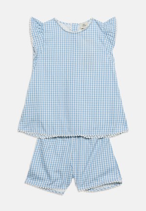 Blue and white houndstooth sleeveless top with ruffled edges paired with matching shorts, designed for toddler girls.