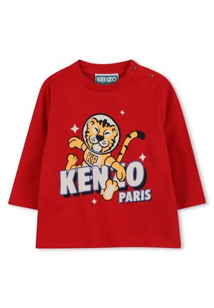 Rotes Baumwollhemd mit langen Ärmeln, das ein Tiger-Motiv und den Text "KENZO PARIS" in Blau und Weiß zeigt. Druckknopfverschluss an der Schulter für ein einfaches Anziehen.