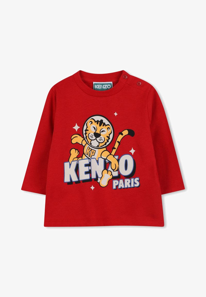 Czerwona bawełniana koszula z długim rękawem z grafiką tygrysa oraz napisem "KENZO PARIS" w niebieskim i białym kolorze. Zapięcie na zatrzask na ramieniu ułatwiające zakładanie.