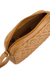 Tan leather crossbody bag with woven texture, rounded shape, zip closure, and a wrist strap. Interior lined; brand logo visible inside.