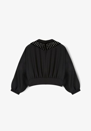 Schwarze verkürzte Jacke mit geraffter Taille, Ballonärmeln und einem mit Metallnieten verzierten Kragen. Glatter Stoff mit mattem Finish.