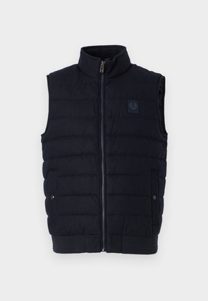 Gilet senza maniche trapuntato di colore blu navy con colletto a imbuto, zip frontale, due tasche con bottone a pressione e piccola patch con logo sul petto.