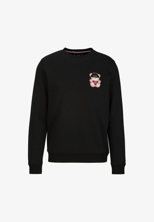 Schwarzer Sweatshirt aus weichem Material, mit einem Bären-Graphic auf der linken Brust mit roten und blauen Akzenten, runder Ausschnitt und gerippten Bündchen.