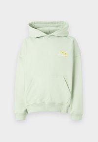 Lys grønn hettegenser med frontlomme og lite brodert design av sitroner og teksten "On Vacation Club" på brystet.