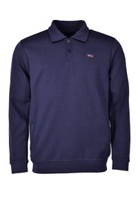 Tummansininen pitkähihaisen polo-paita, joka on valmistettu puuvillasekoitteesta. Paidassa on kaulus, kahden napin listavetoketju ja pieni logo rinnassa.