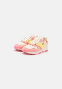 Pink and cream sneakers with yellow accents, featuring a mix of mesh and suede materials, round toe, and white laces. Textured rubber sole.