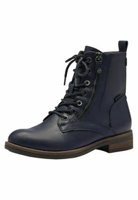 Bottines en cuir marine avec lacets décoratifs, fermeture éclair sur le côté et bout rond. Pr ésentent une finition texturée et un petit talon empilé.