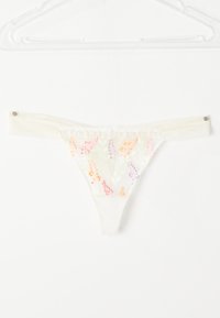 Witte sheer thong met kleurrijke bloemborduursels. Zacht materiaal, kantafwerking en zijknoppen. Delicaat ontwerp met oranje, paars en groene details.