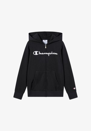 Sweat à capuche noir avec fermeture éclair, fabriqué en tissu doux, arborant un logo "Champion" blanc sur le devant, deux poches avant et une capuche.